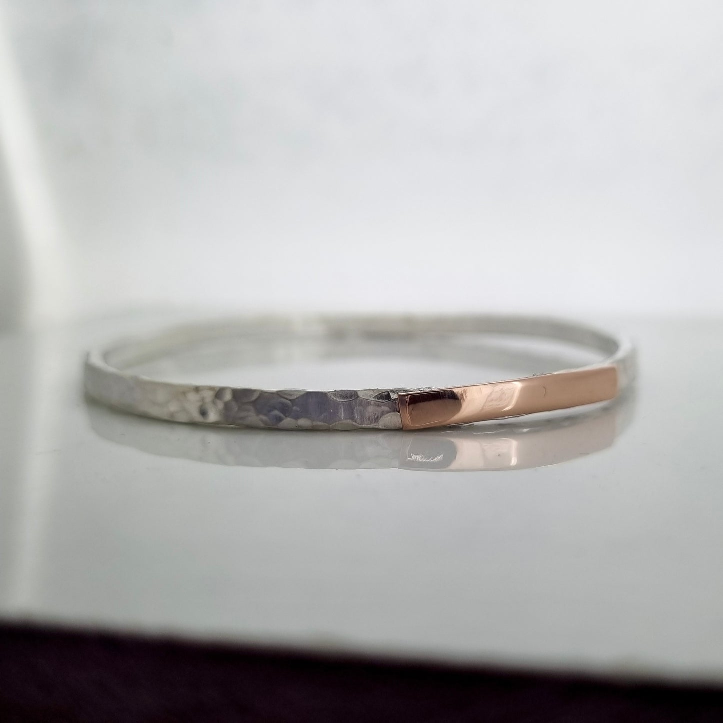 Inch of strength - silver hammered bangle with an inch of gold
