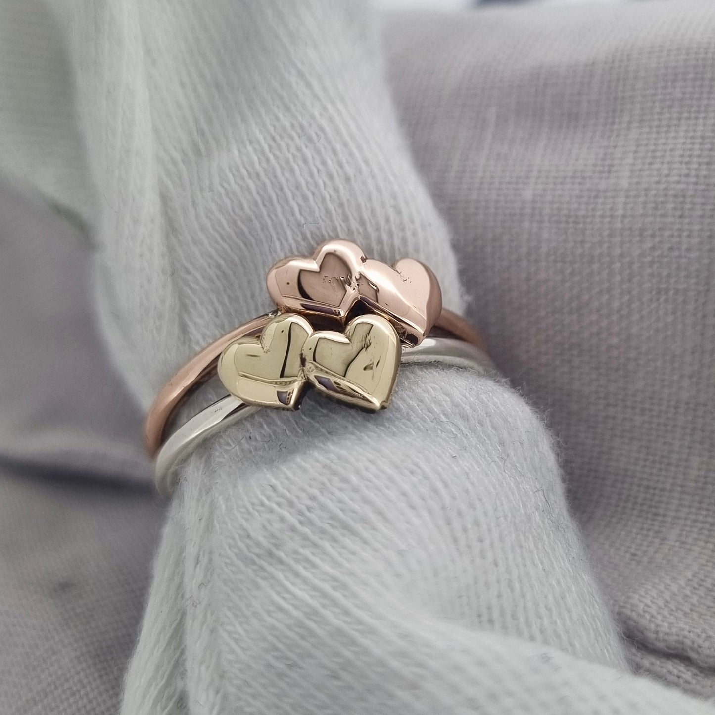 Shared Love - solid gold sweetheart ring with a pair of gold hearts