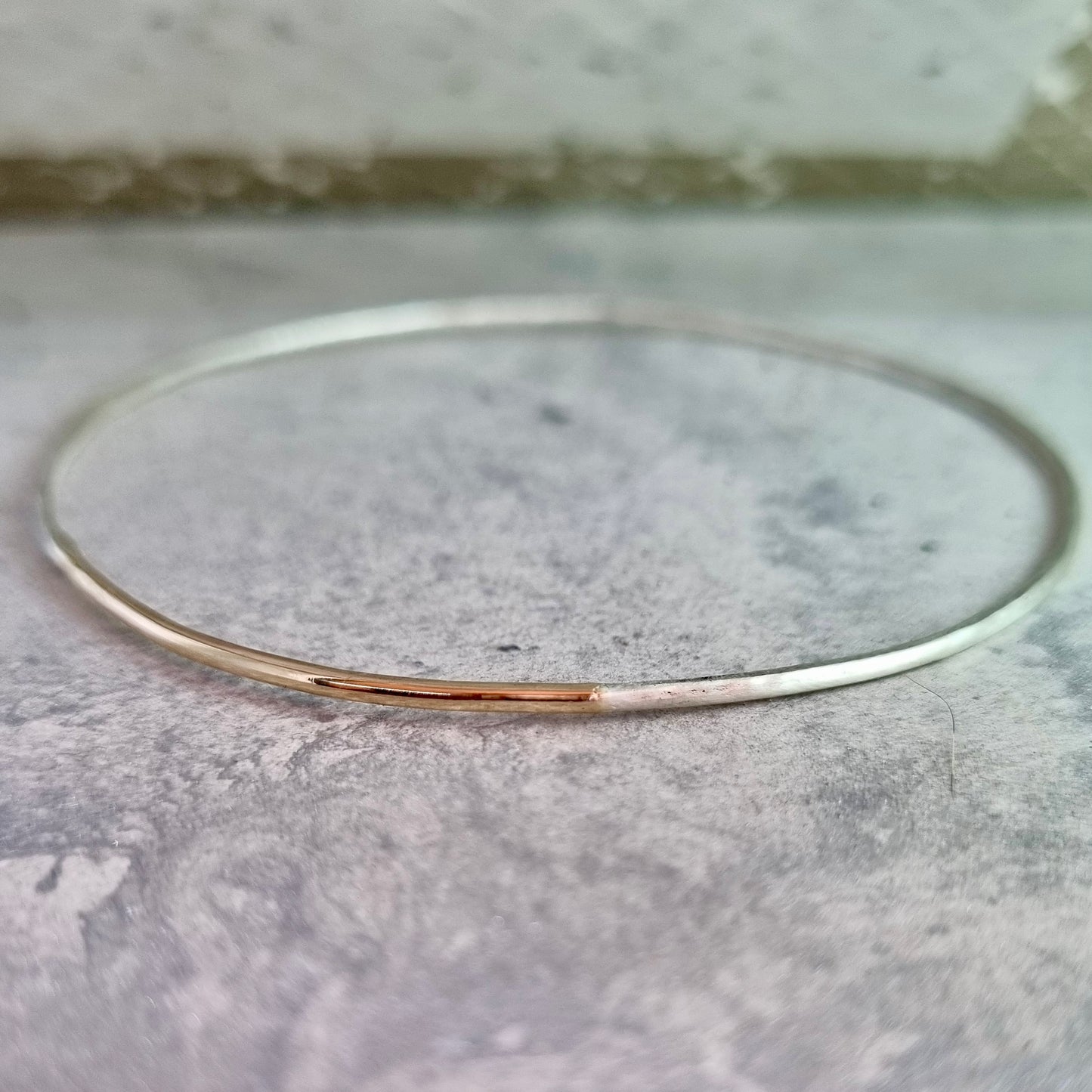 Inch of strength - silver hammered bangle with an inch of gold