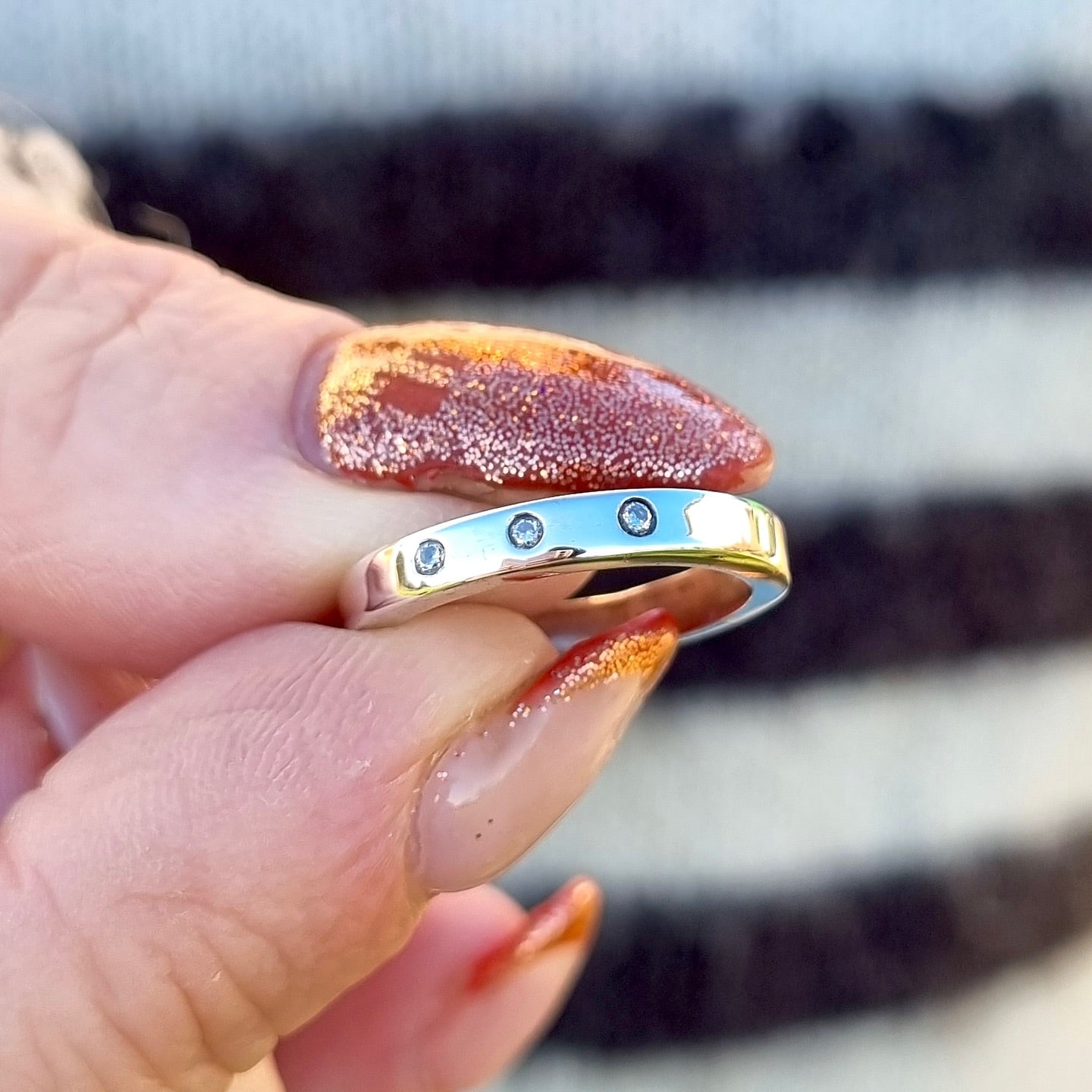 Silver band with trio of diamonds