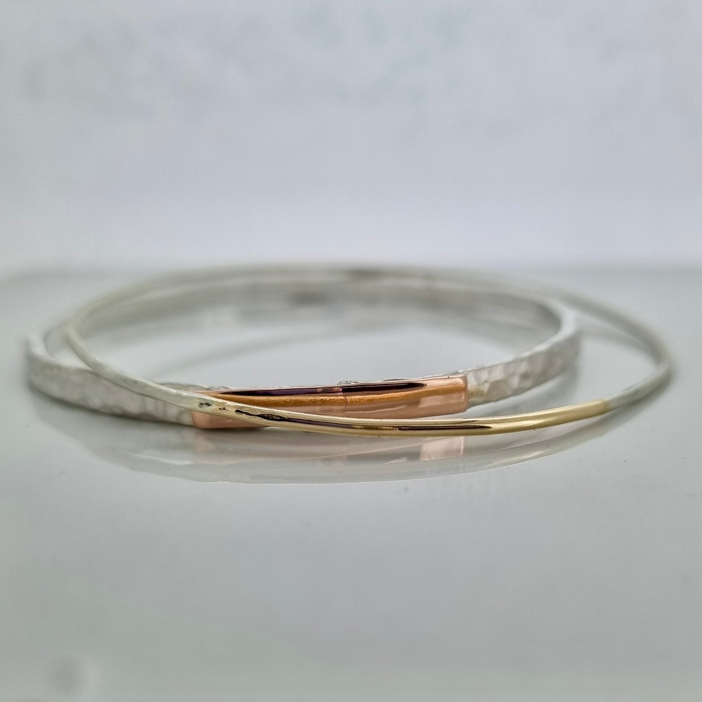 Inch of strength - silver hammered bangle with an inch of gold