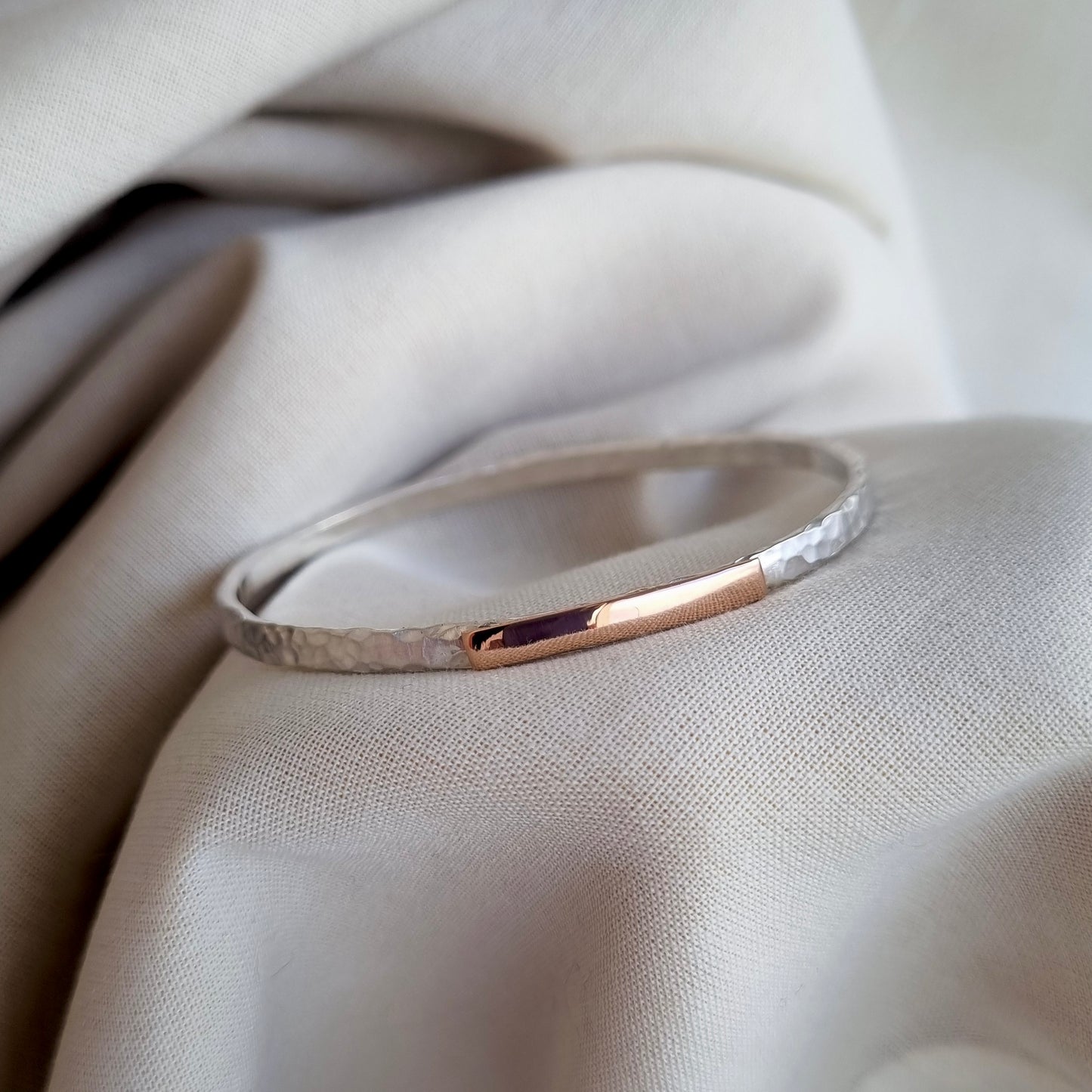 Inch of strength - silver hammered bangle with an inch of gold
