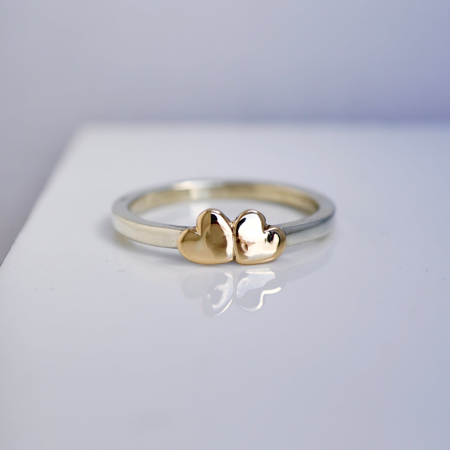 2 gold hearts with medium band