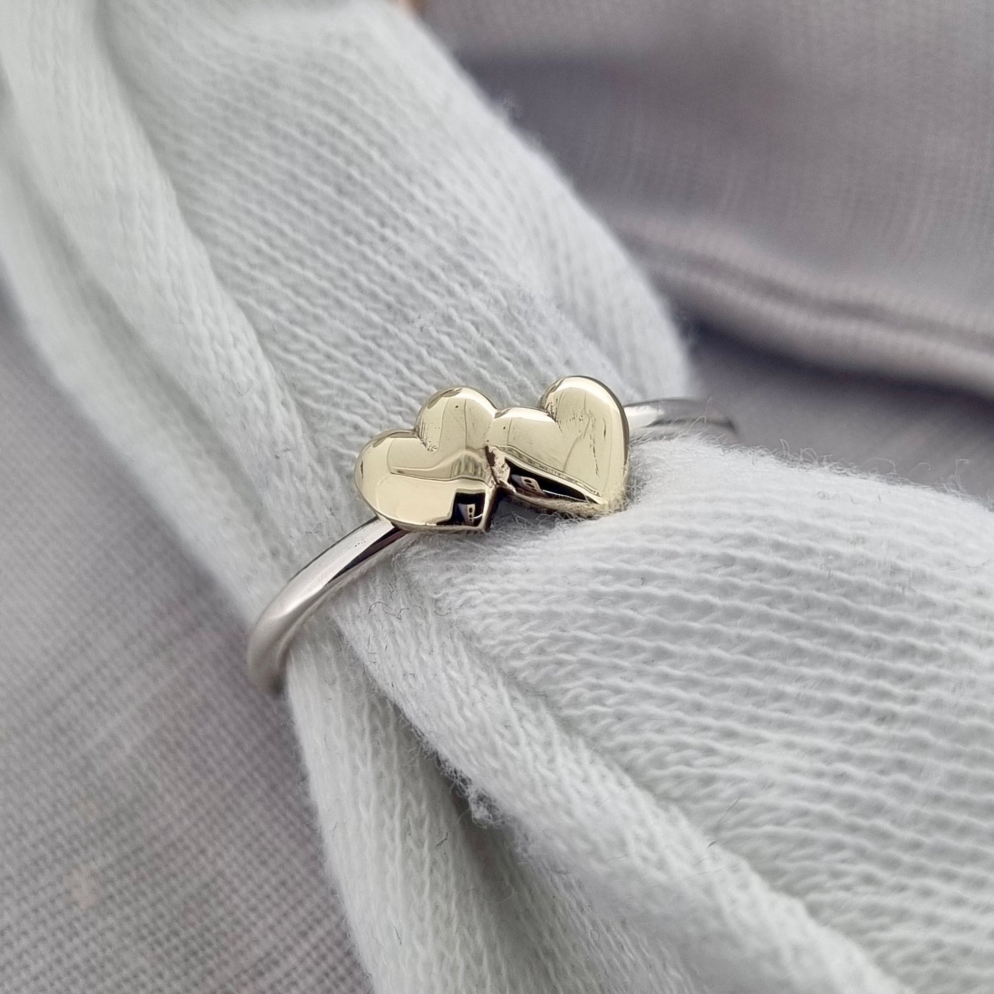 Shared Love - solid gold sweetheart ring with a pair of gold hearts