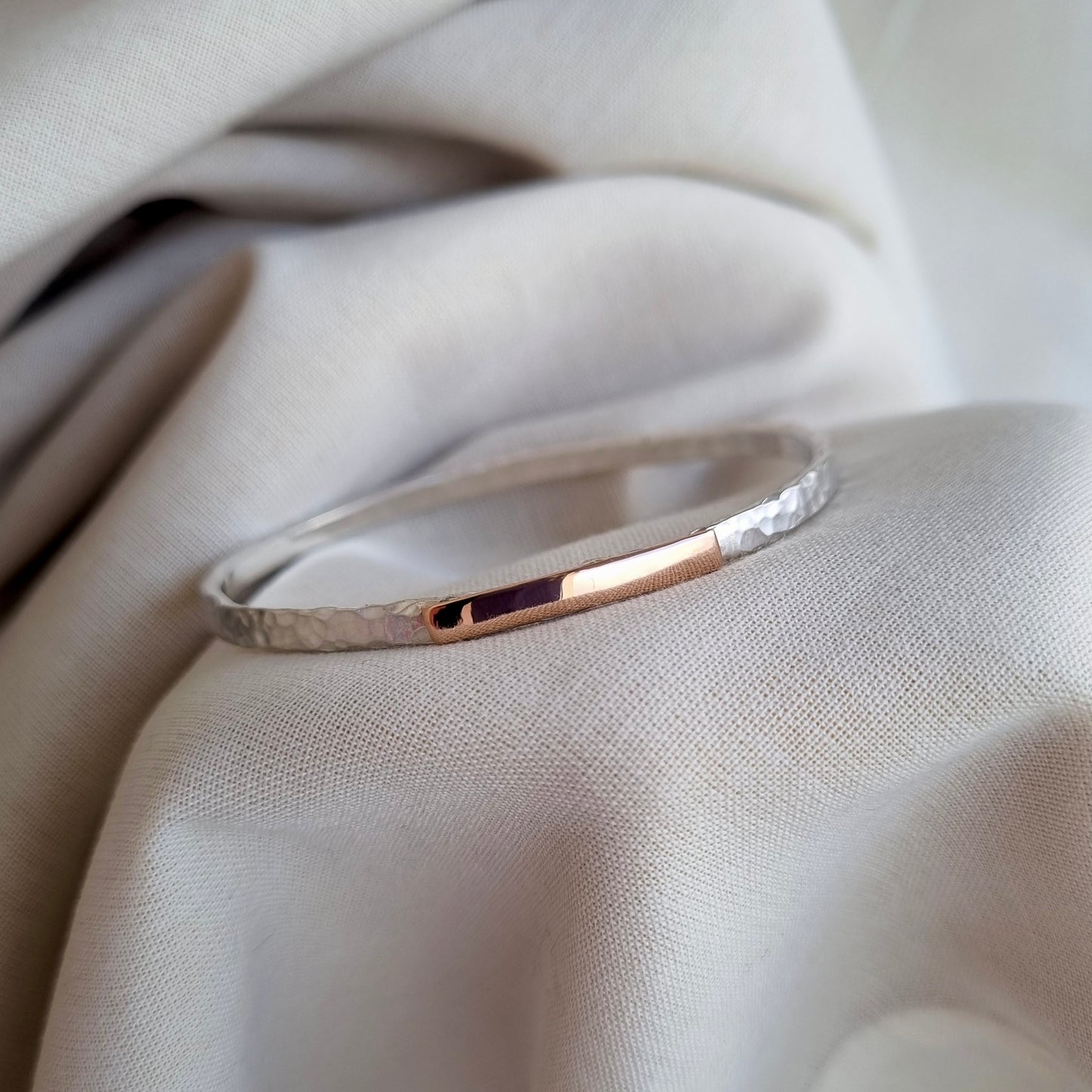 Inch of strength - silver hammered bangle with an inch of gold