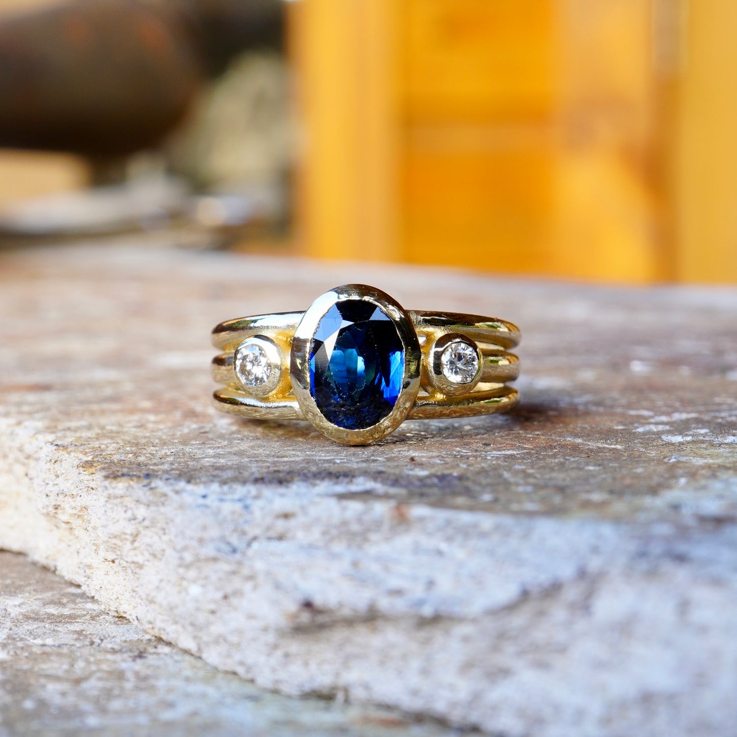 Cariad Lite in gold with large sapphire