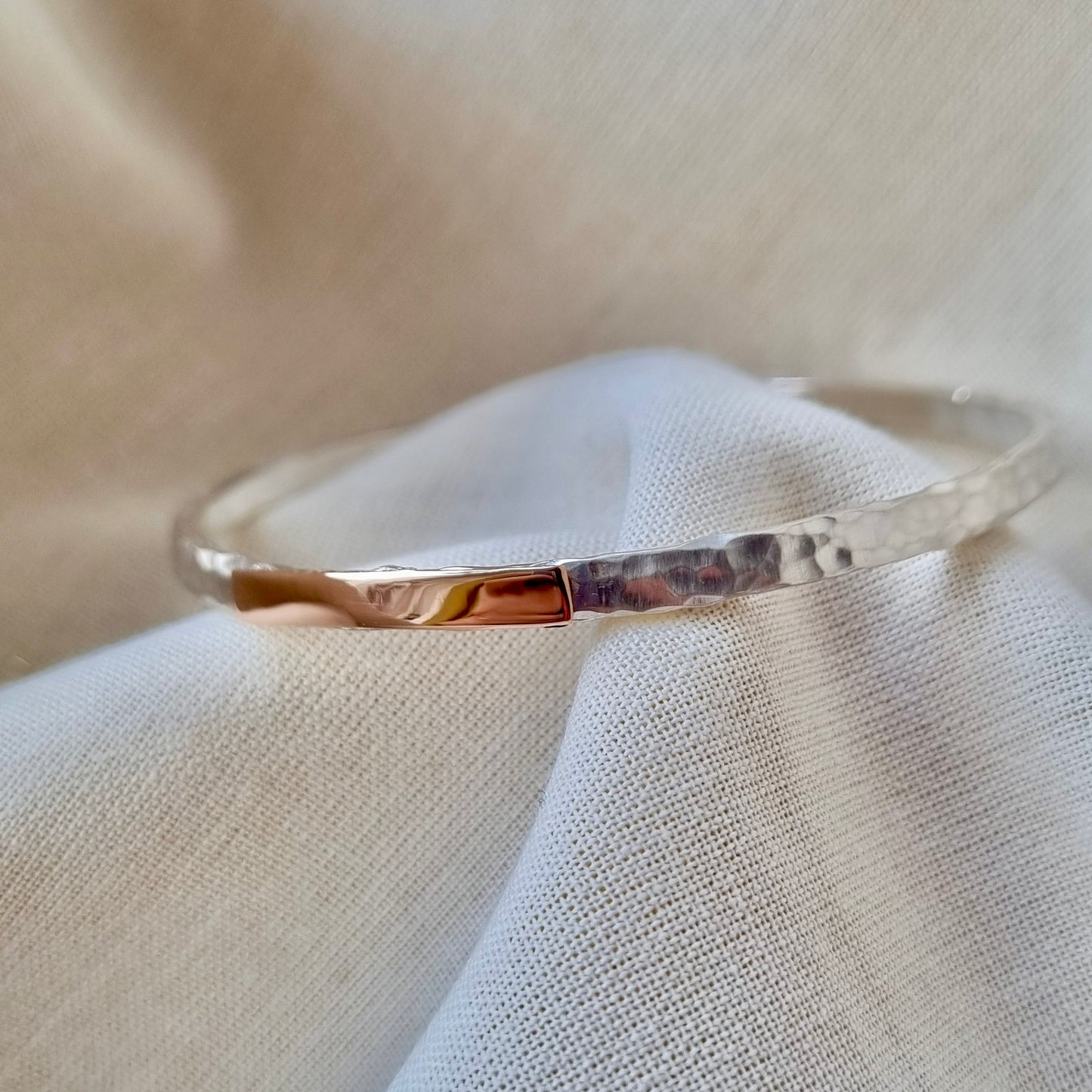 Inch of strength - silver hammered bangle with an inch of gold