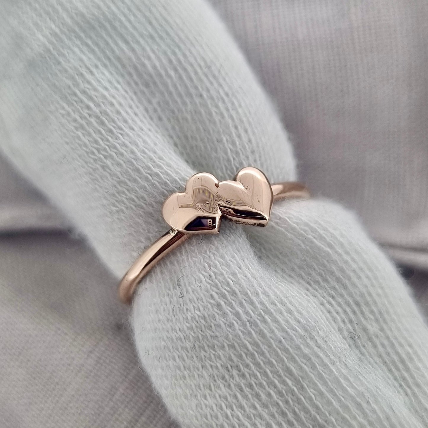 Shared Love - solid gold sweetheart ring with a pair of gold hearts
