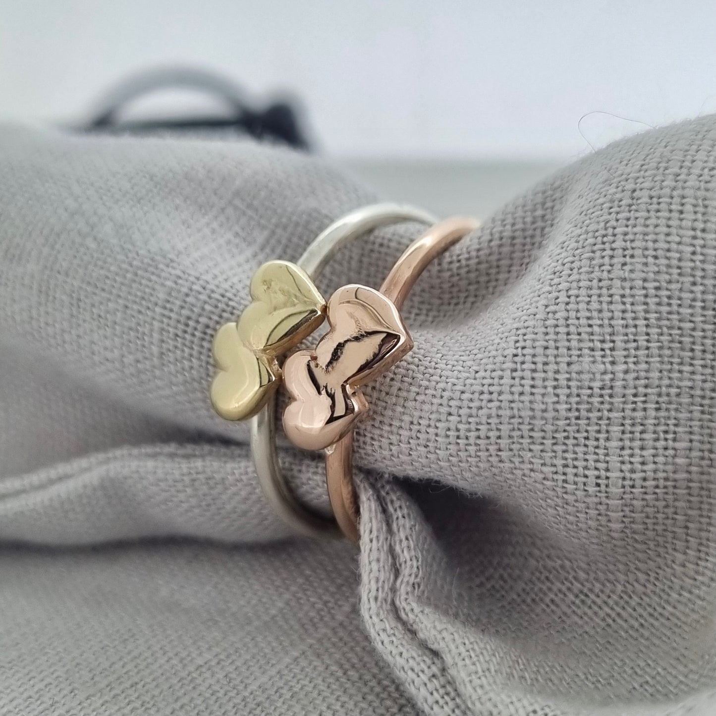 Shared Love - solid gold sweetheart ring with a pair of gold hearts