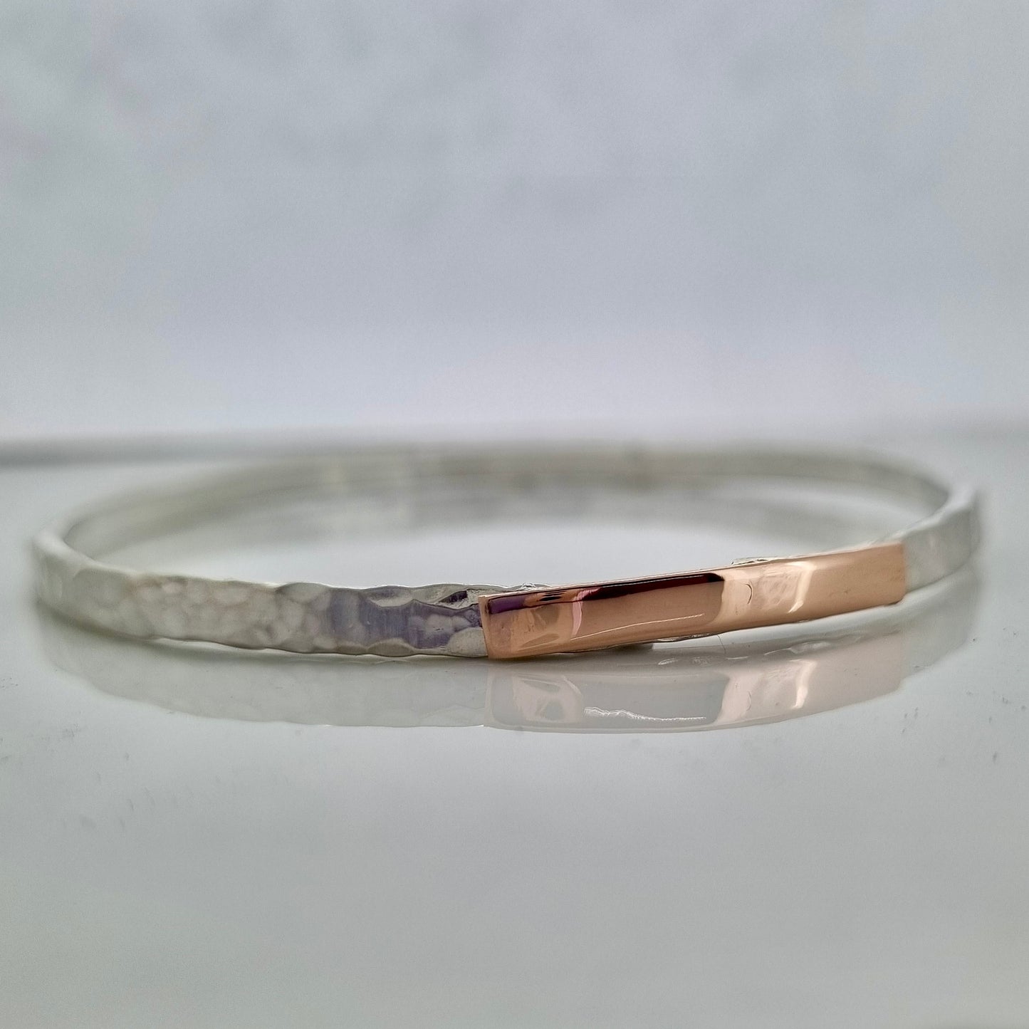 Inch of strength - silver hammered bangle with an inch of gold