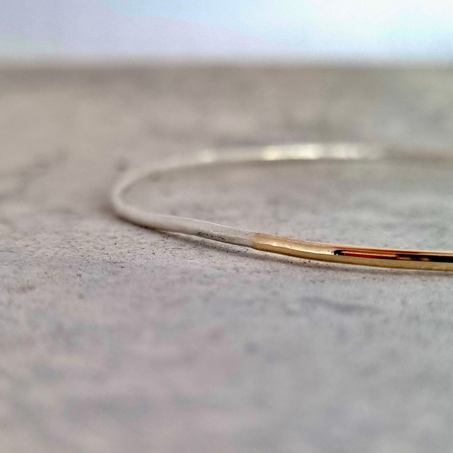Inch of strength - silver hammered bangle with an inch of gold