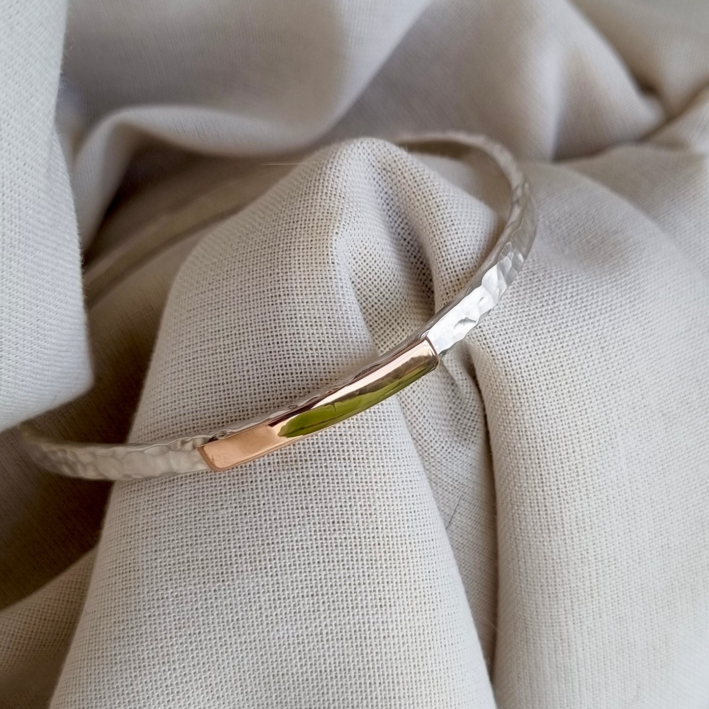 Inch of strength - silver hammered bangle with an inch of gold