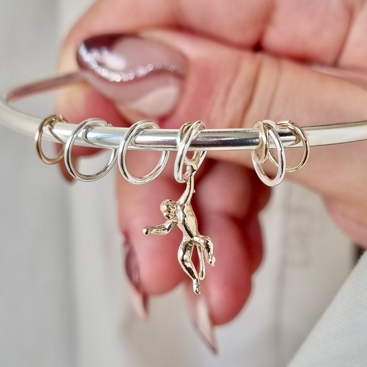 Monkey puzzle - silver bangle with gold monkey and sliding hoops