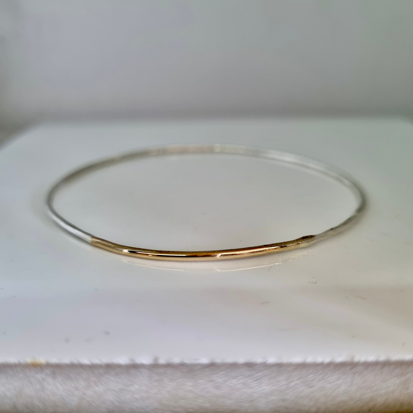 Inch of strength - silver hammered bangle with an inch of gold