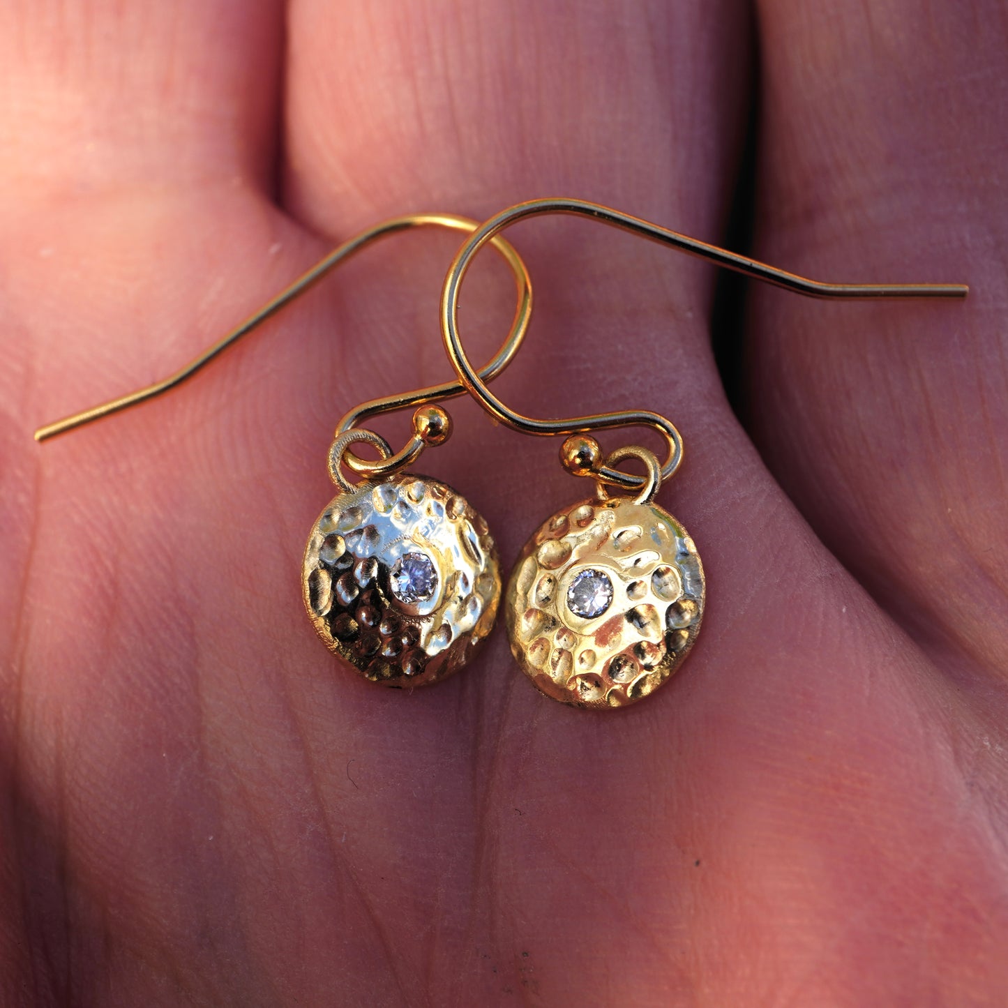 Gold gong earrings with diamonds