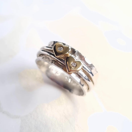 Two hearts sparkle as one - Silver, gold and sparkling diamonds