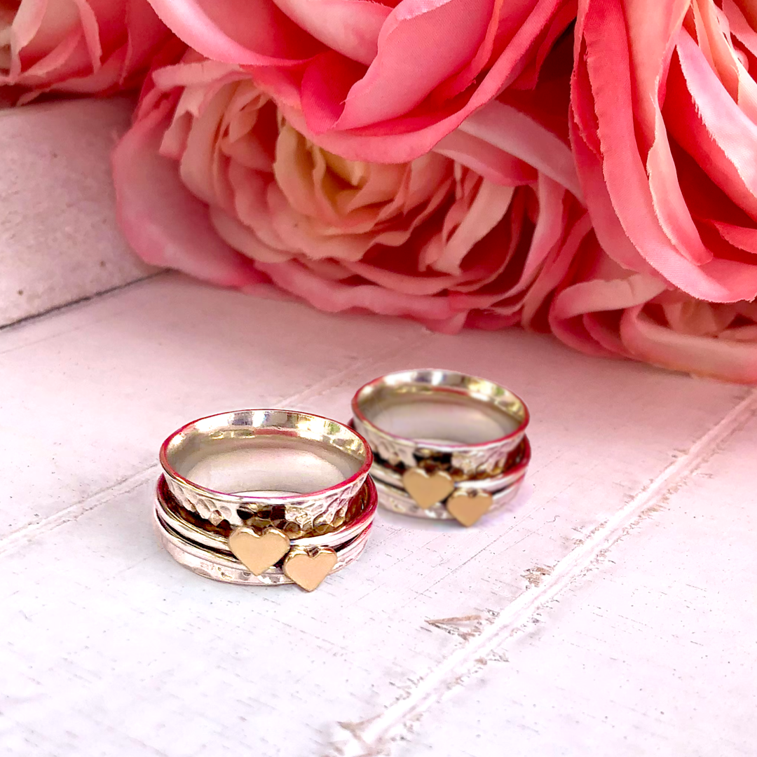 Two hearts beat as one. Her and her wedding rings
