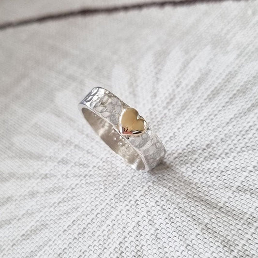 'Be Mine'. Charming hand hammered sterling silver ring set with solid gold heart.