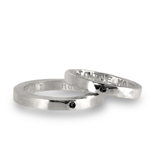 Silver wedding bands set with black diamonds