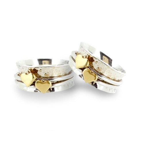 Two hearts beat as one. Her and her wedding rings