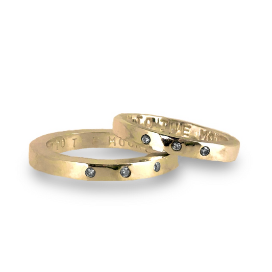 Gold wedding bands with sparkling diamonds