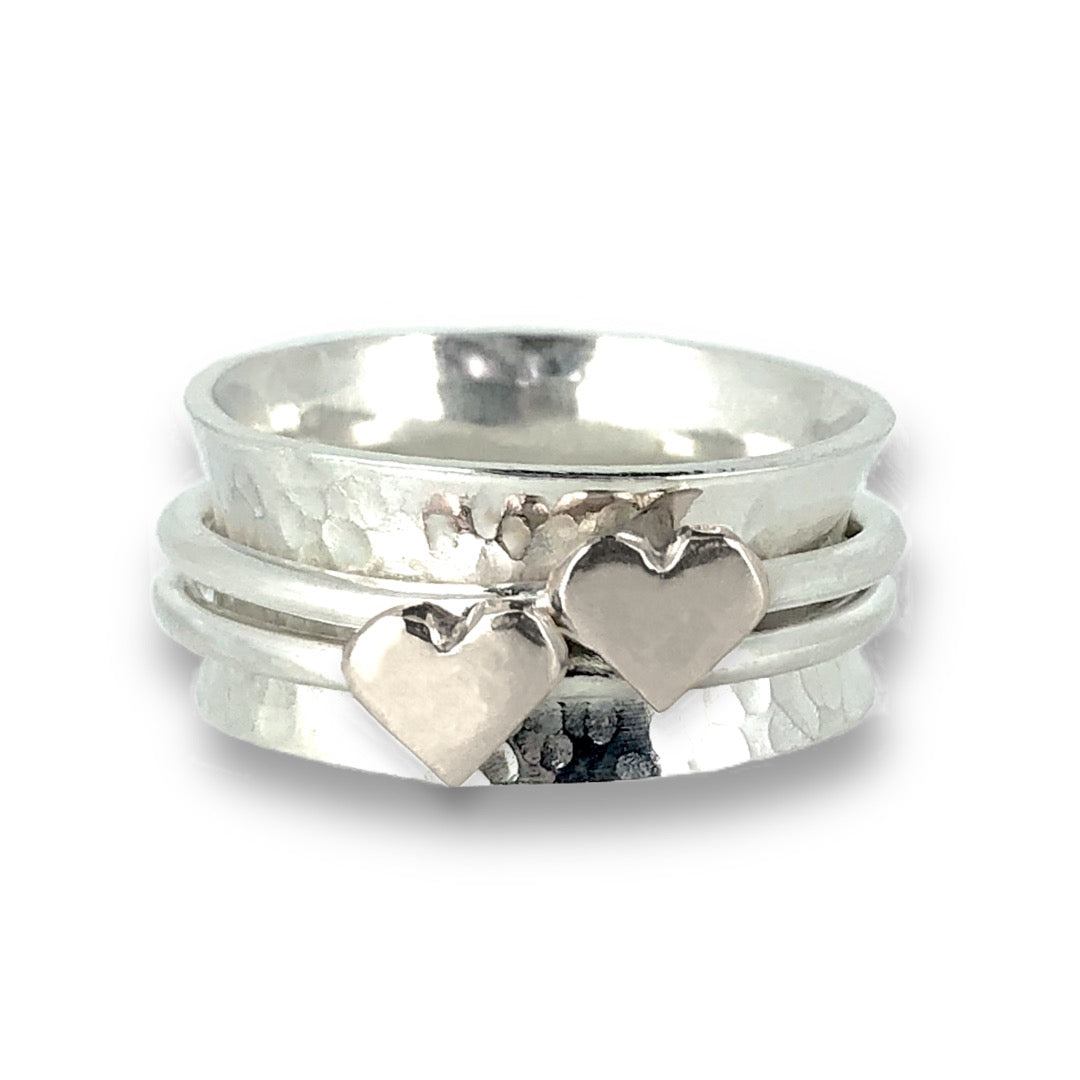 Two hearts beat as one. Her and her wedding rings