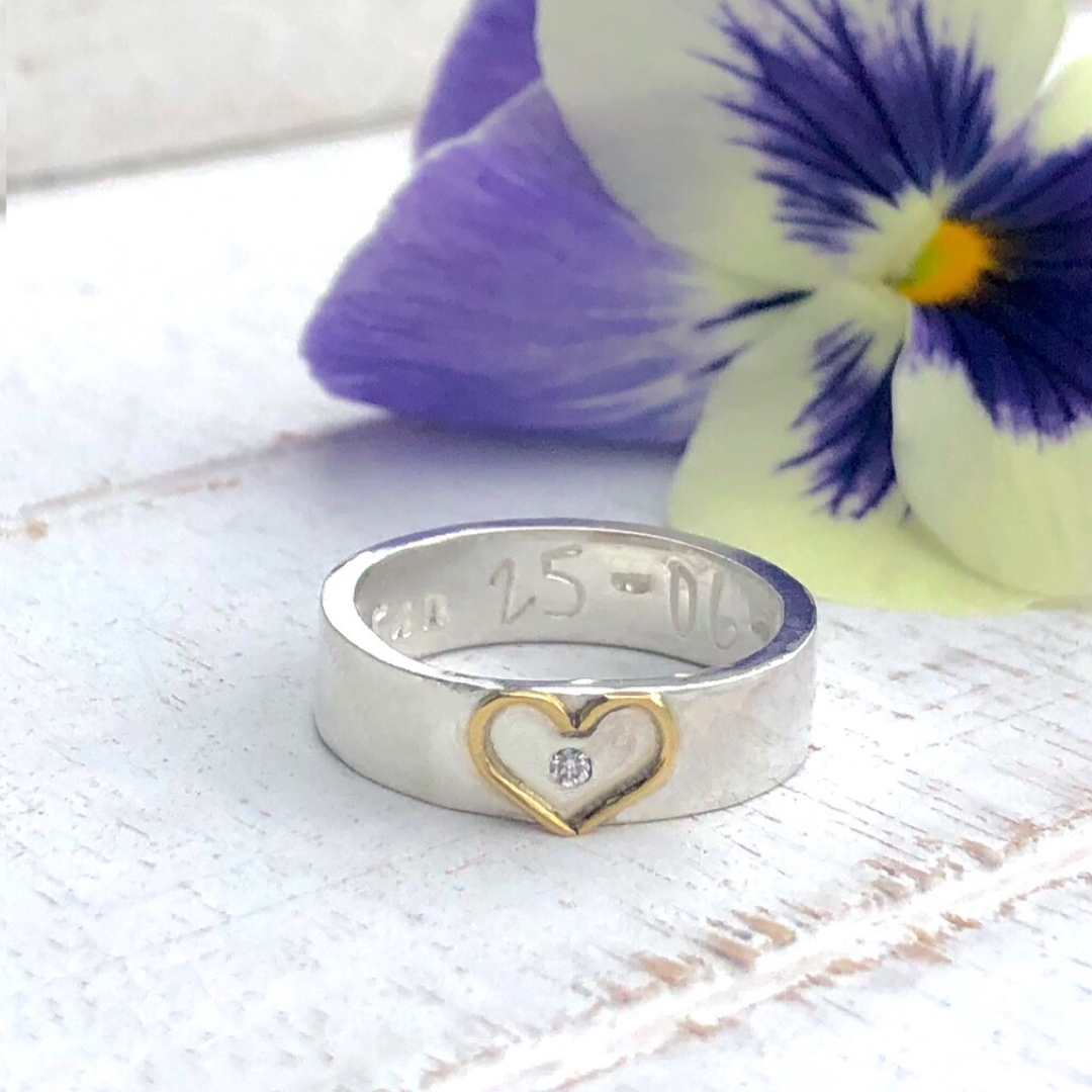 Silver band with 18ct gold open heart. Add a diamond for extra sparkle.