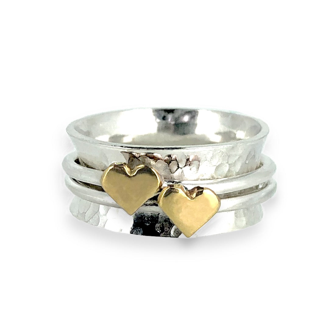 Two hearts beat as one. Gold or silver hearts.