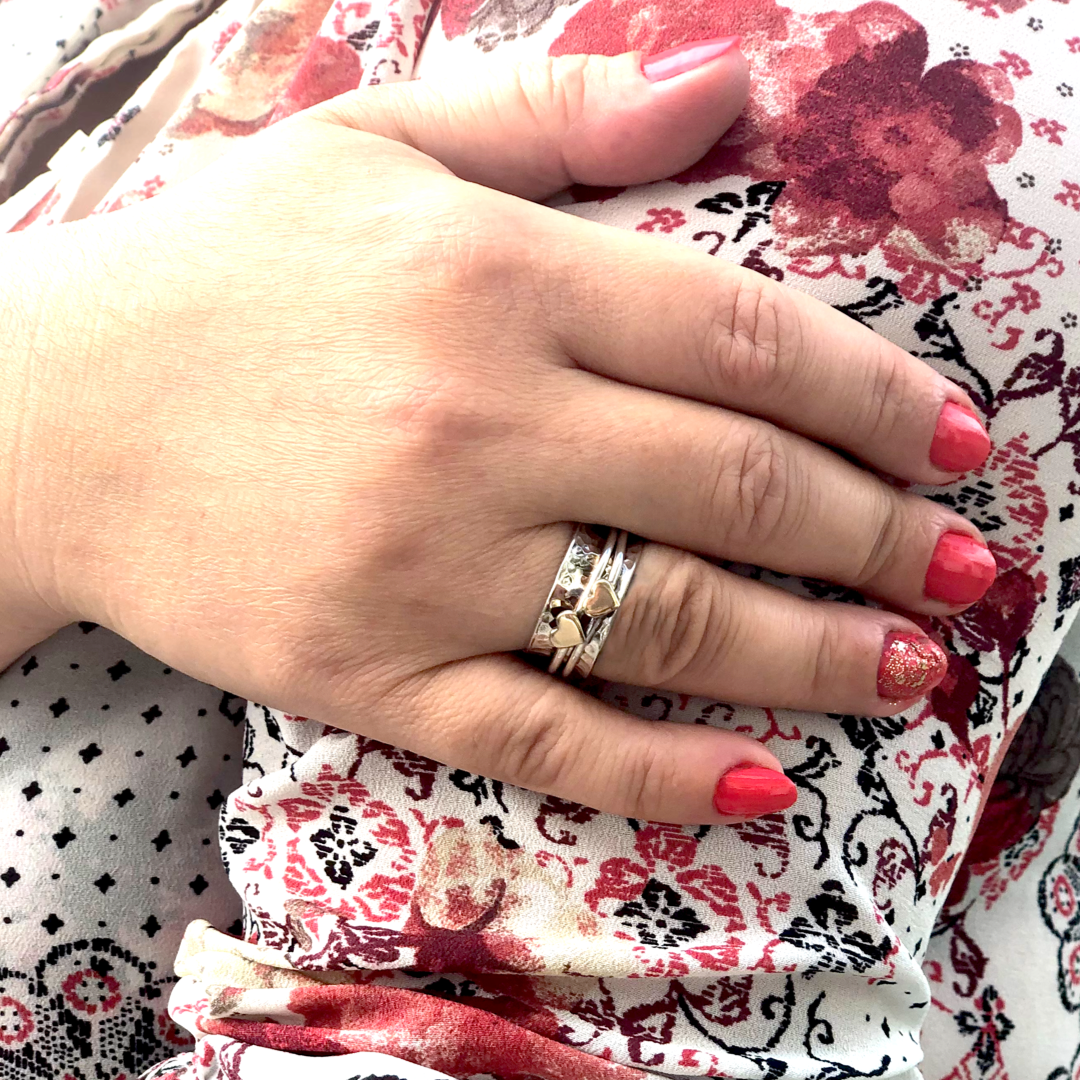 Two hearts beat as one. Her and her wedding rings