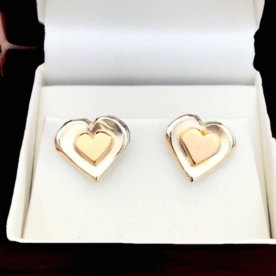 Silver and gold heart earrings.