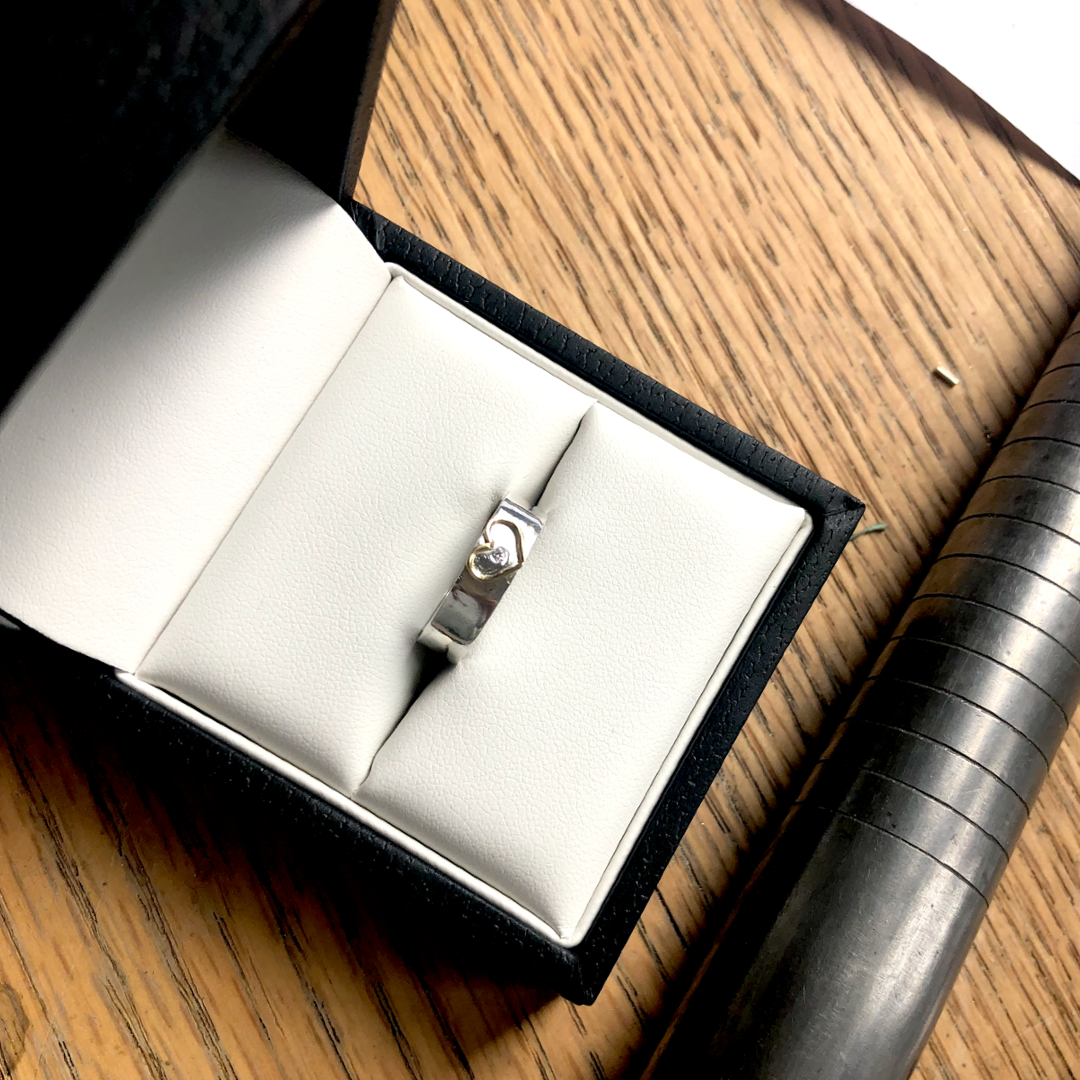 Silver band with 18ct gold open heart. Add a diamond for extra sparkle.