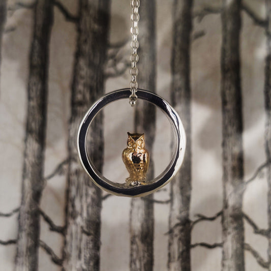 Teeny tiny gold owl peeping out of silver halo