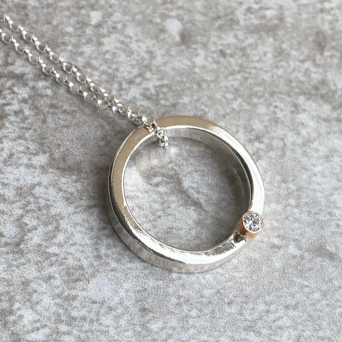 Halo necklace with gemstone set in 9ct gold