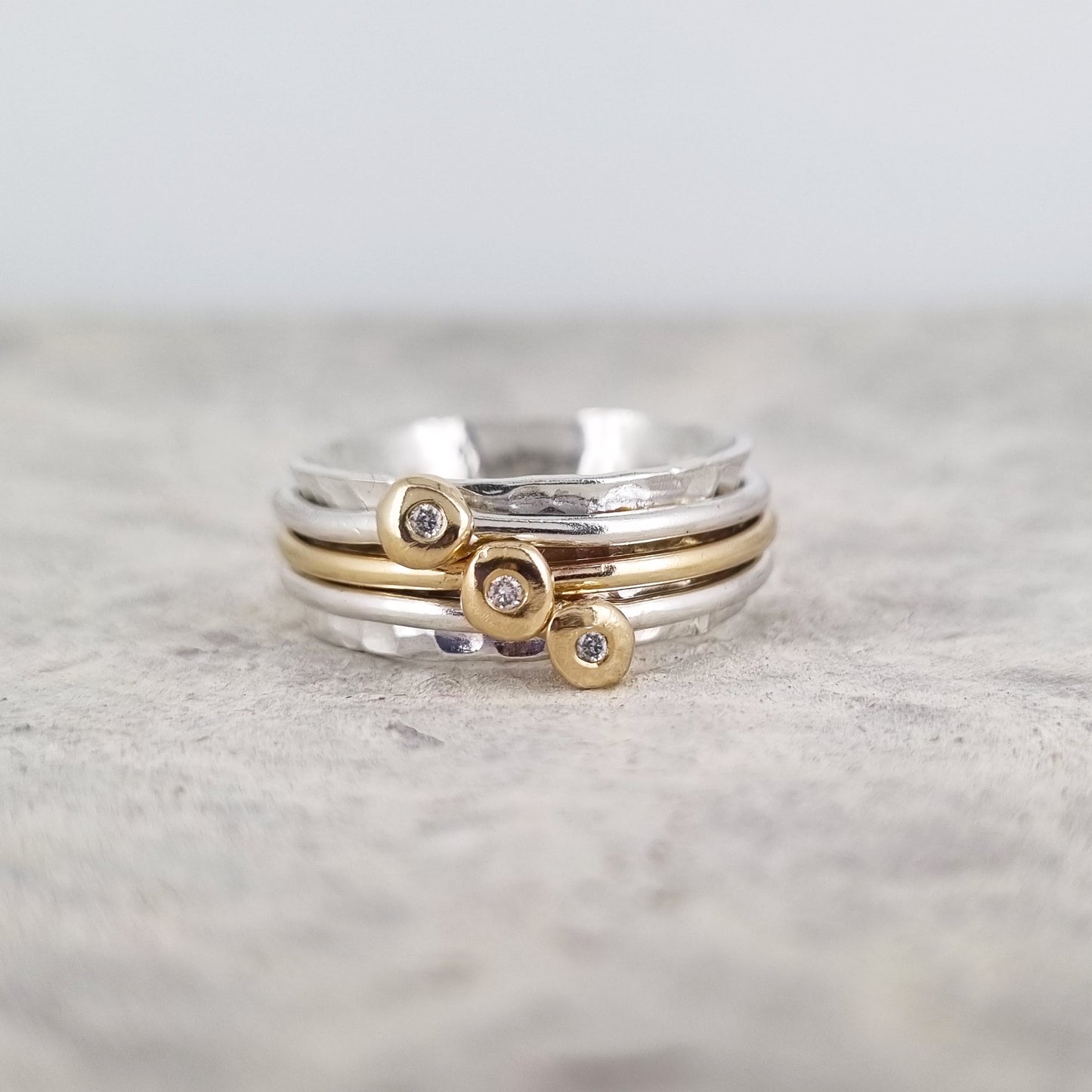 Mini 'Cariad' spinning ring handmade with solid gold, silver and diamonds