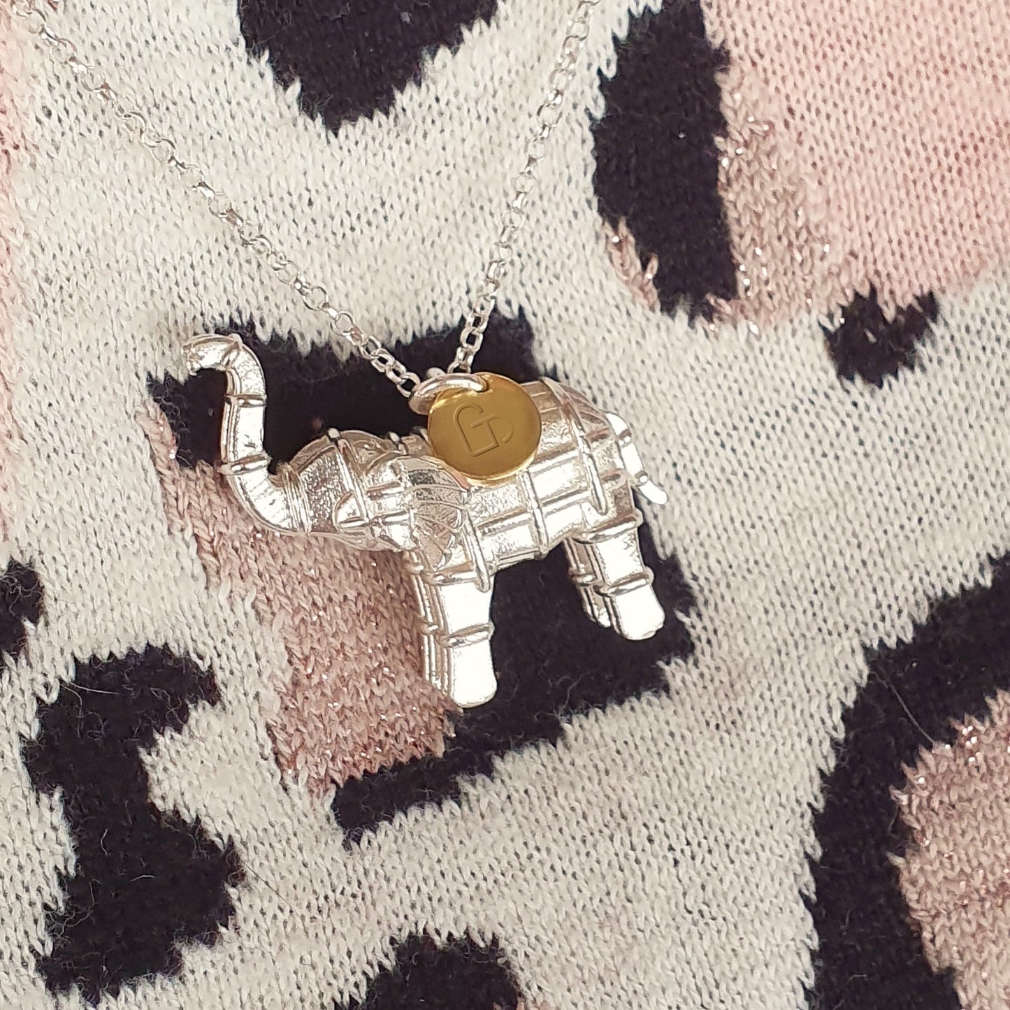 Solid silver elephant necklace with gold heart tag