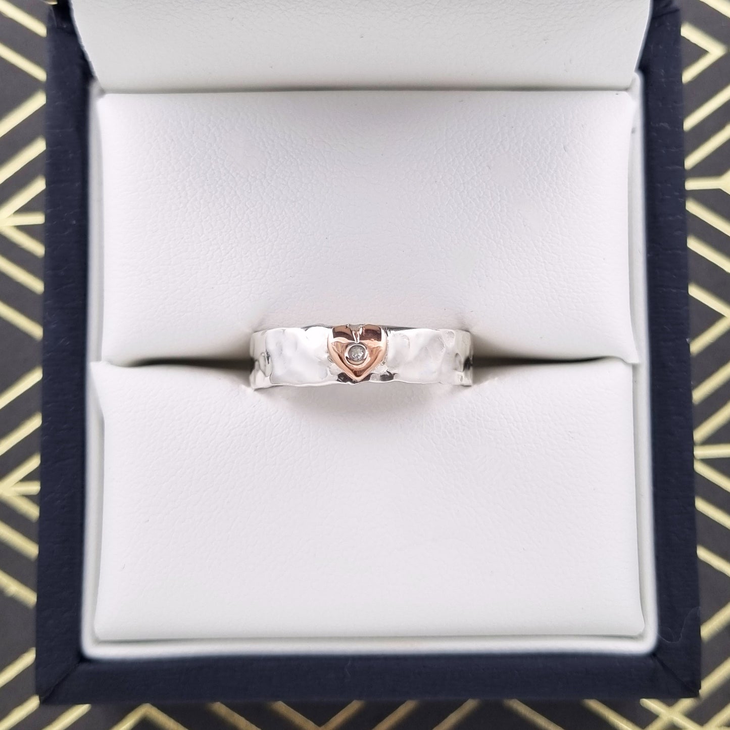 'Be Mine'. Charming hand hammered sterling silver ring set with solid gold heart.