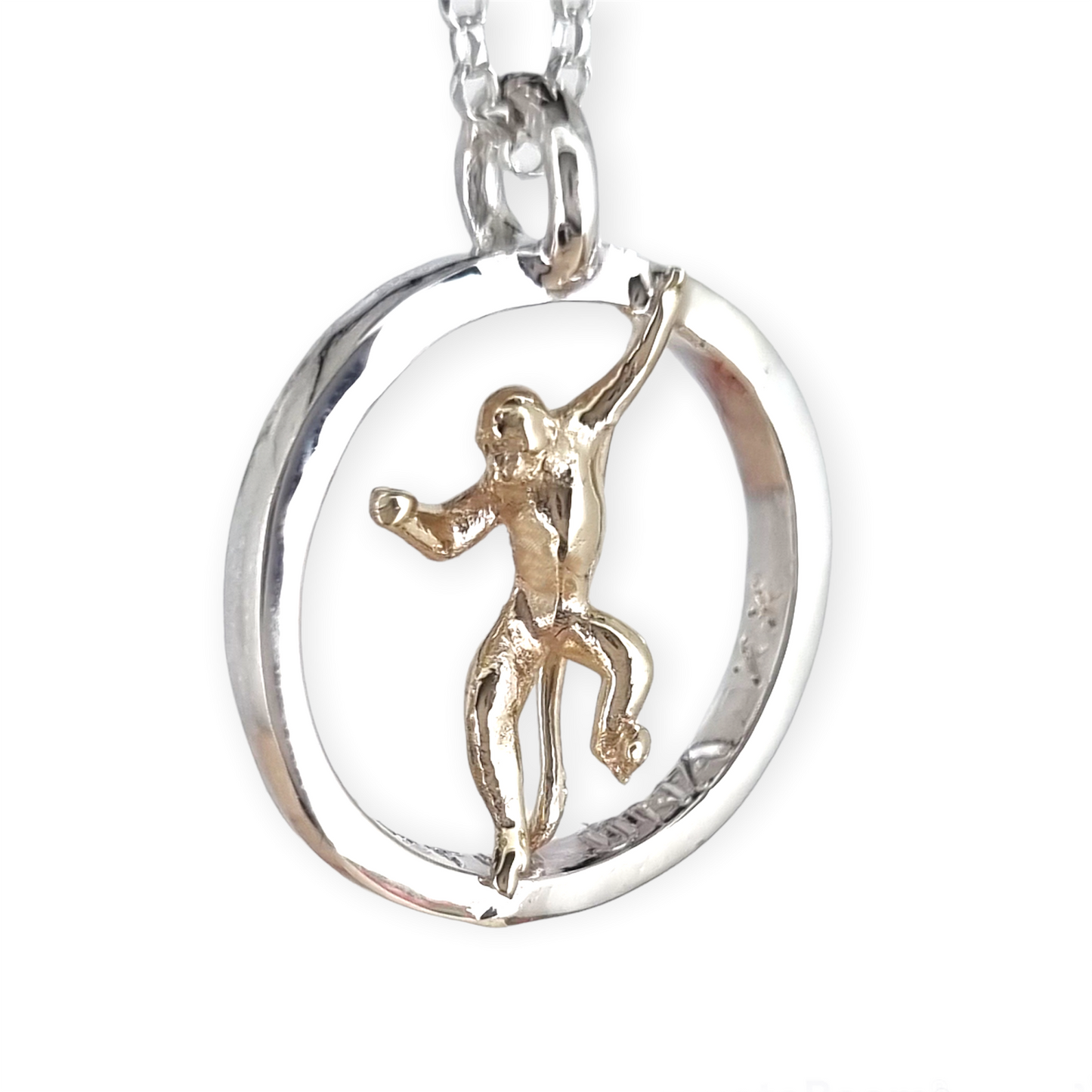 Teeny tiny gold monkey peeping out of silver halo