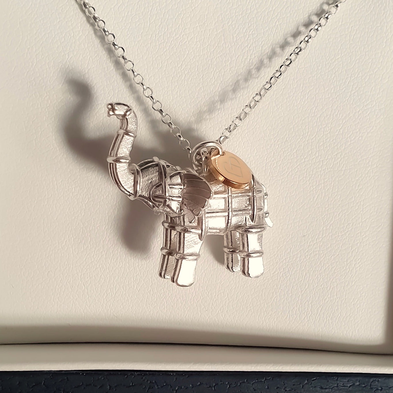 Solid silver elephant necklace with gold heart tag