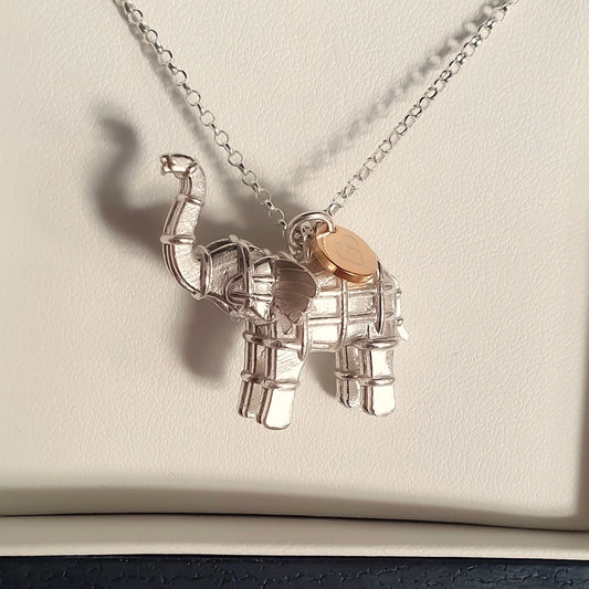 Solid silver elephant necklace with gold heart tag