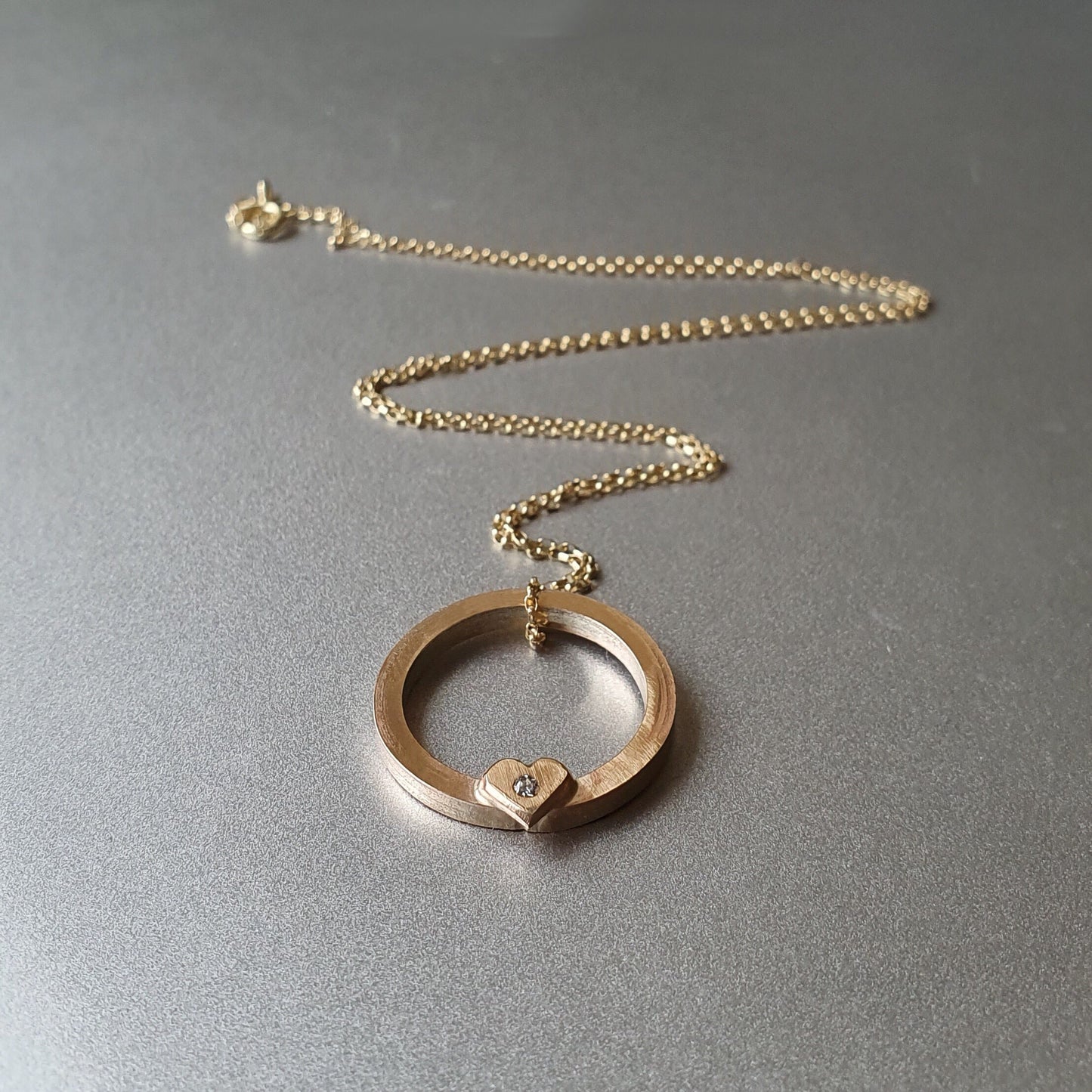 Solid gold ‘One love’ necklace with gold heart and diamond