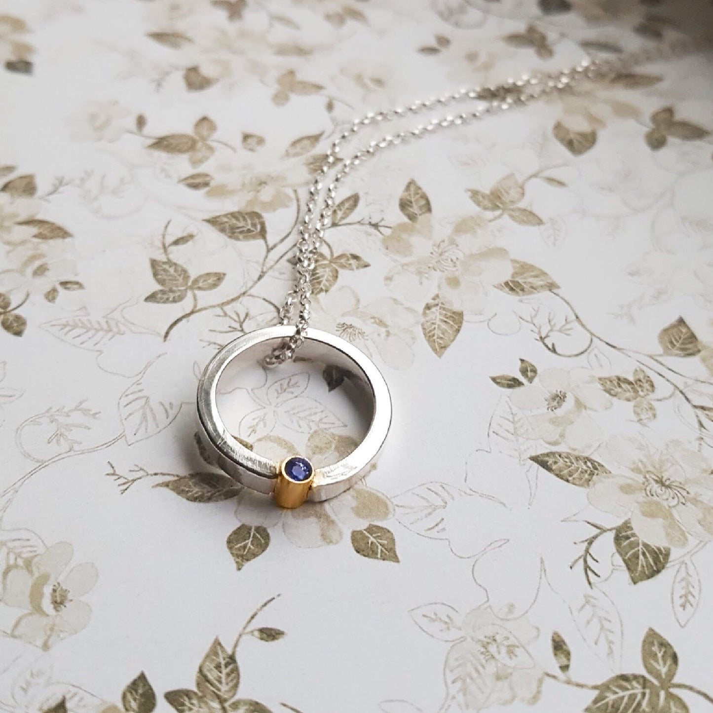 Halo necklace with gemstone set in 9ct gold