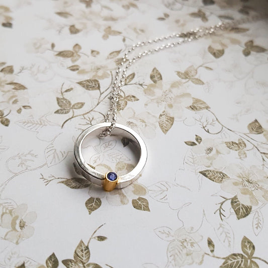 Halo necklace with gemstone set in 9ct gold