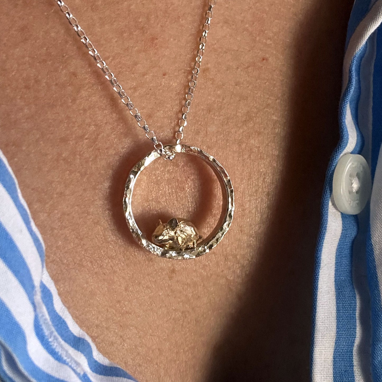 Teeny tiny gold mouse peeping out of silver halo