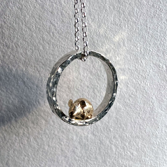 Teeny tiny gold mouse peeping out of silver halo