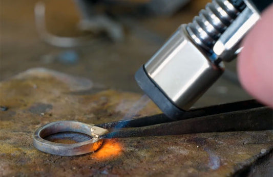 Soldering a solid gold heart to a silver halo