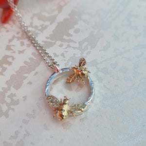 Item 259 - Silver halo with 2 solid gold baby bees - necklace