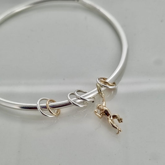 Monkey puzzle  -  silver bangle with gold monkey and sliding hoops