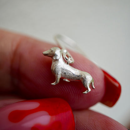 Silver sausage dog earrings