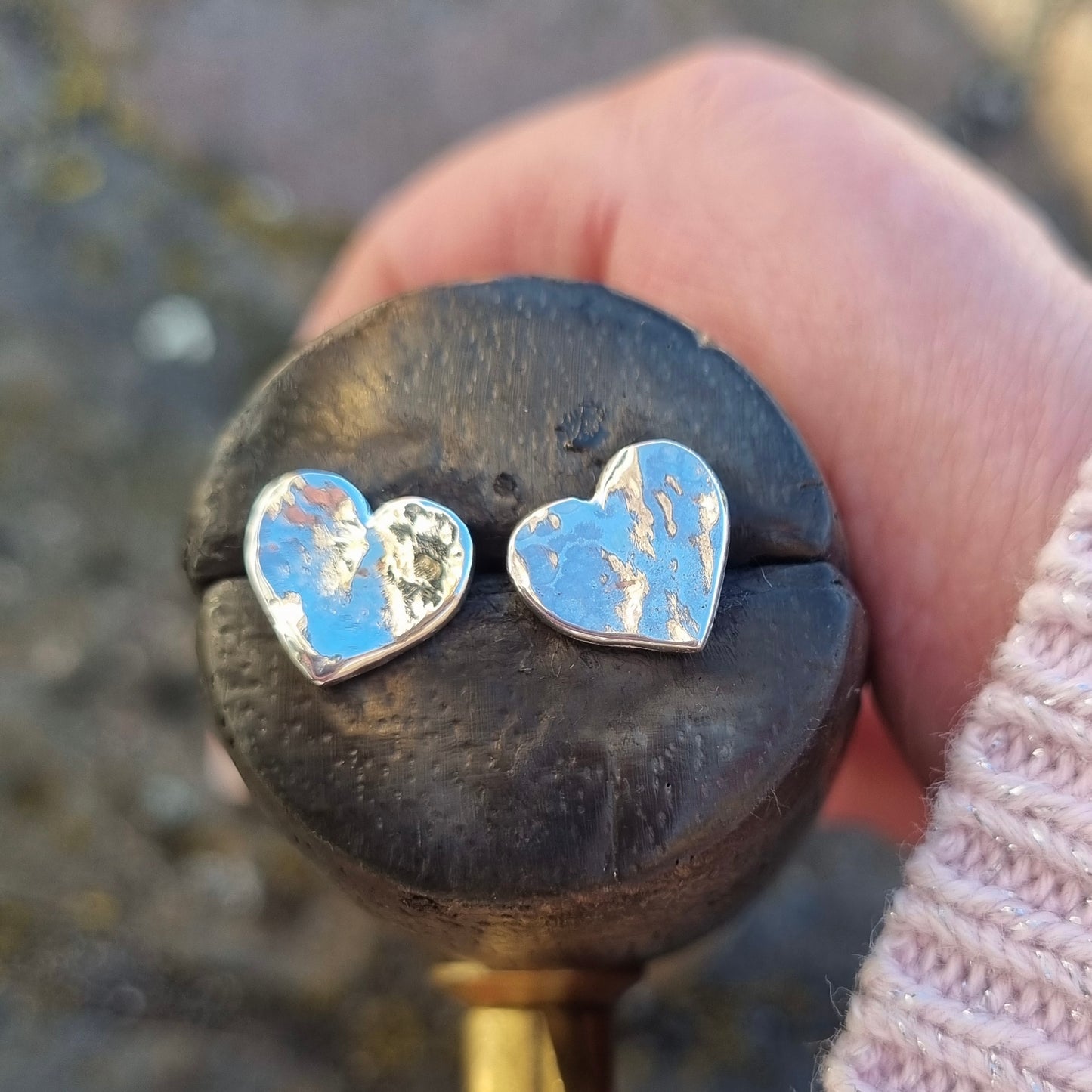 Silver hammered heart earrings.
