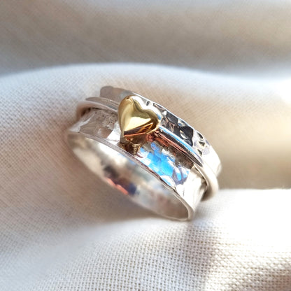 'One Love'. Sterling silver spinning ring with solid gold heart.